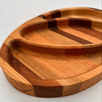 Wooden tray with a striped pattern on a white background