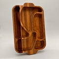Wooden tray with geometric compartments on a light gray background