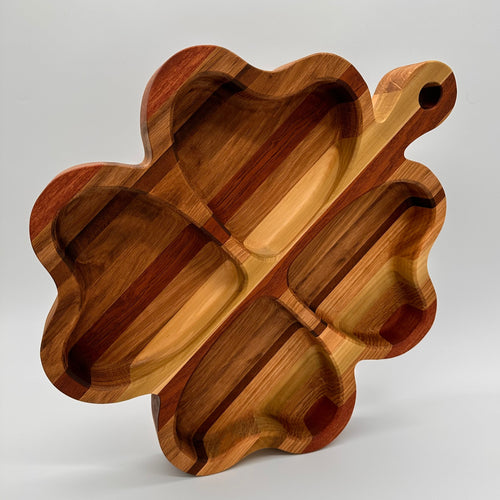 Wooden cutting board with wavy edges on a white background