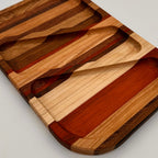 Wooden cutting board with geometric design on a light gray background
