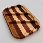 Wooden tray with a striped pattern on a gray background