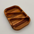 Wooden tray with divided sections on a light gray background