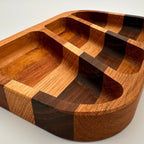 Wooden tray with divided sections on a white background