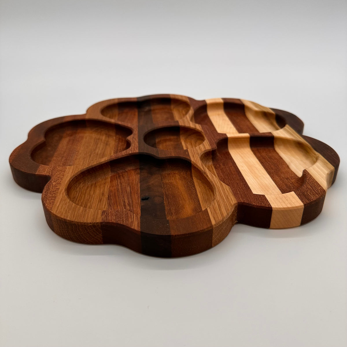 Wooden cutting board with a unique design on a light gray background