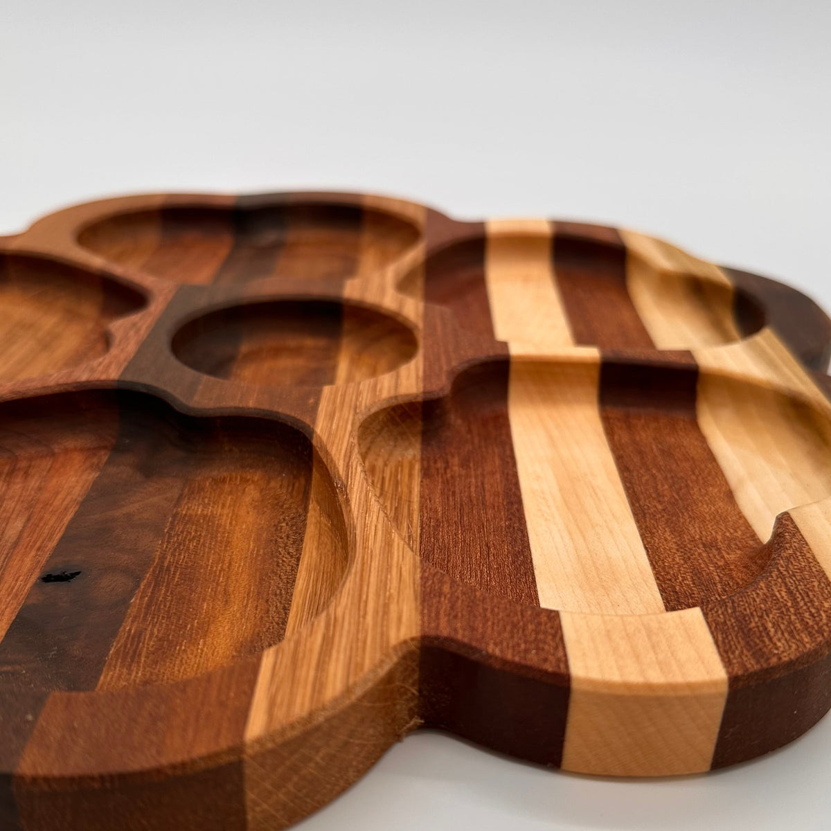 Wooden cutting board with a unique design on a white background