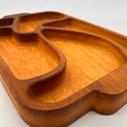 Wooden tray with a unique design on a white background