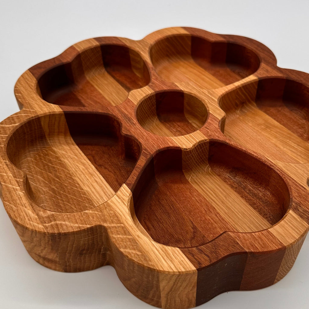 Wooden tray with multiple compartments on a white background