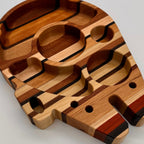 Wooden cutting board with geometric design on a gray background