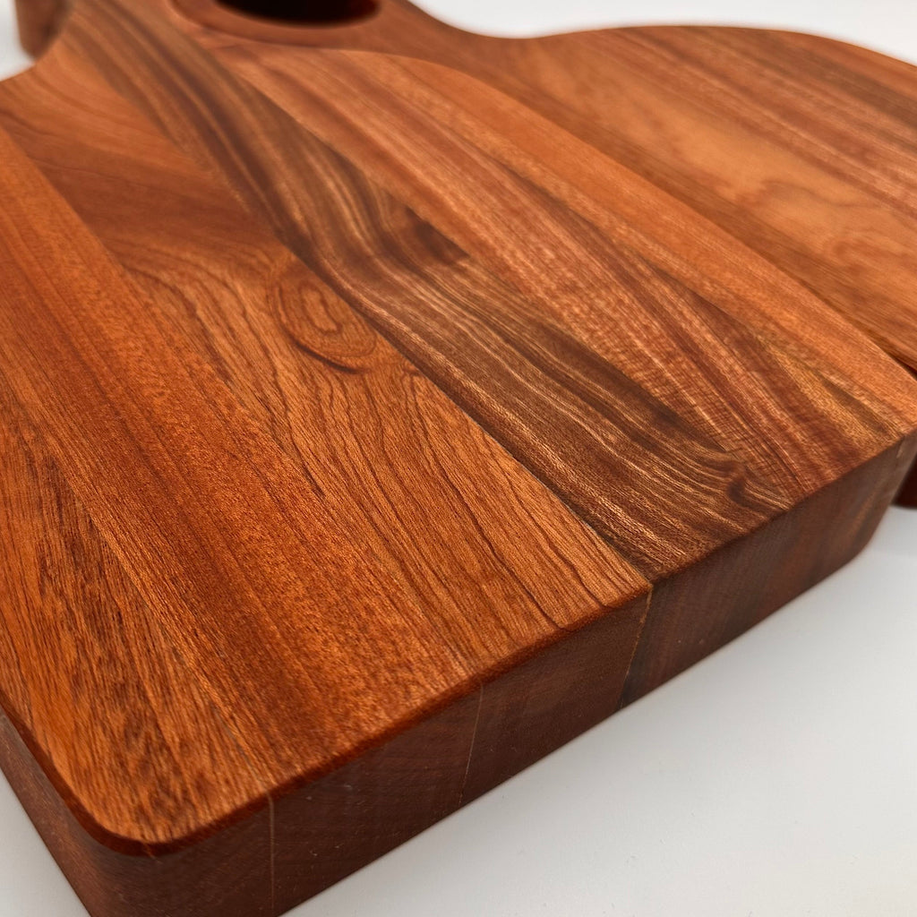 Wooden cutting board with a smooth finish on a white background