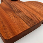 Wooden cutting board with a smooth finish on a white background