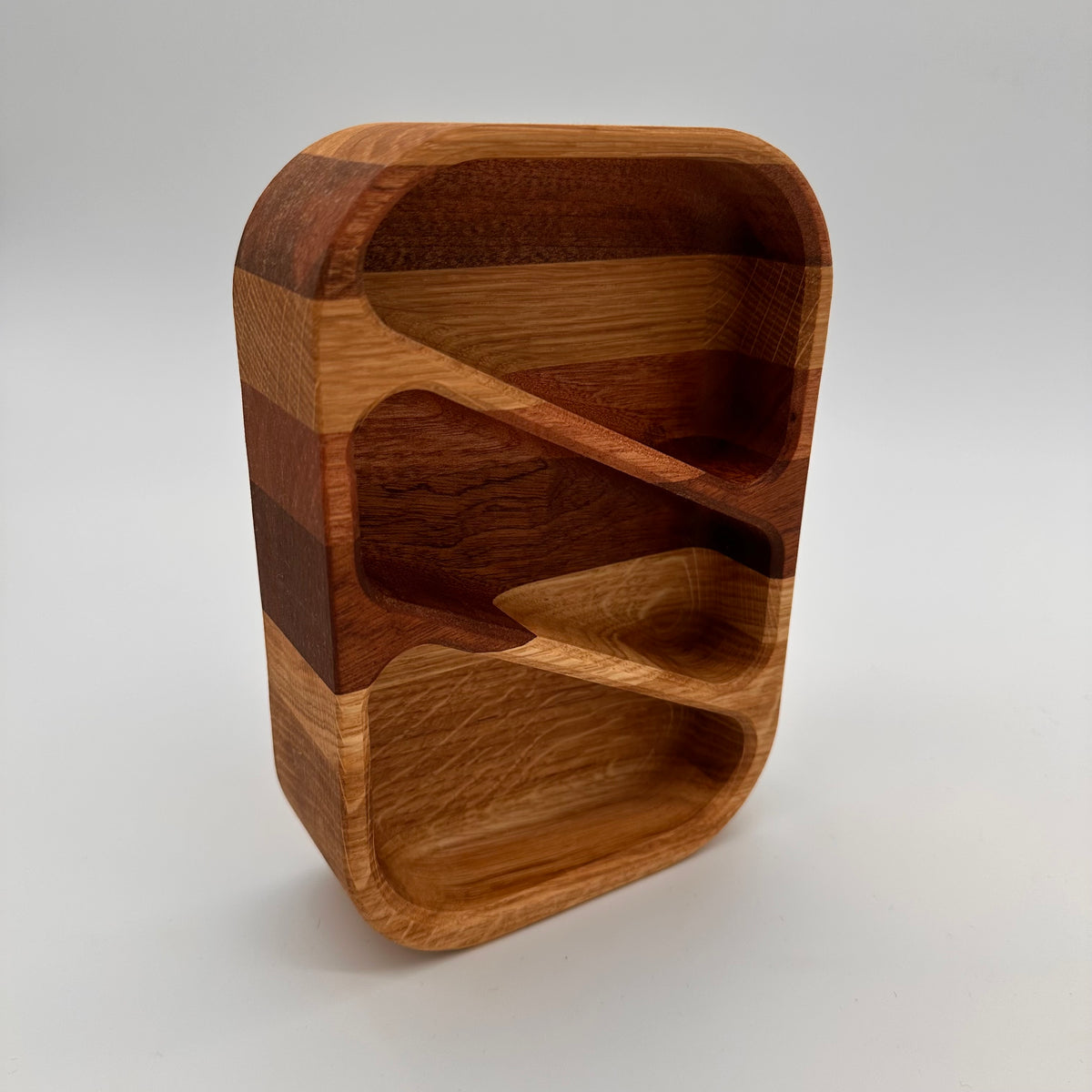 Wooden cutting board with a unique grain pattern on a white background