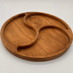 Wooden tray with divided sections on a white background