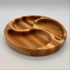 Wooden tray with divided sections on a light gray background
