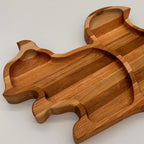 Wooden bear-shaped tray on a light gray background