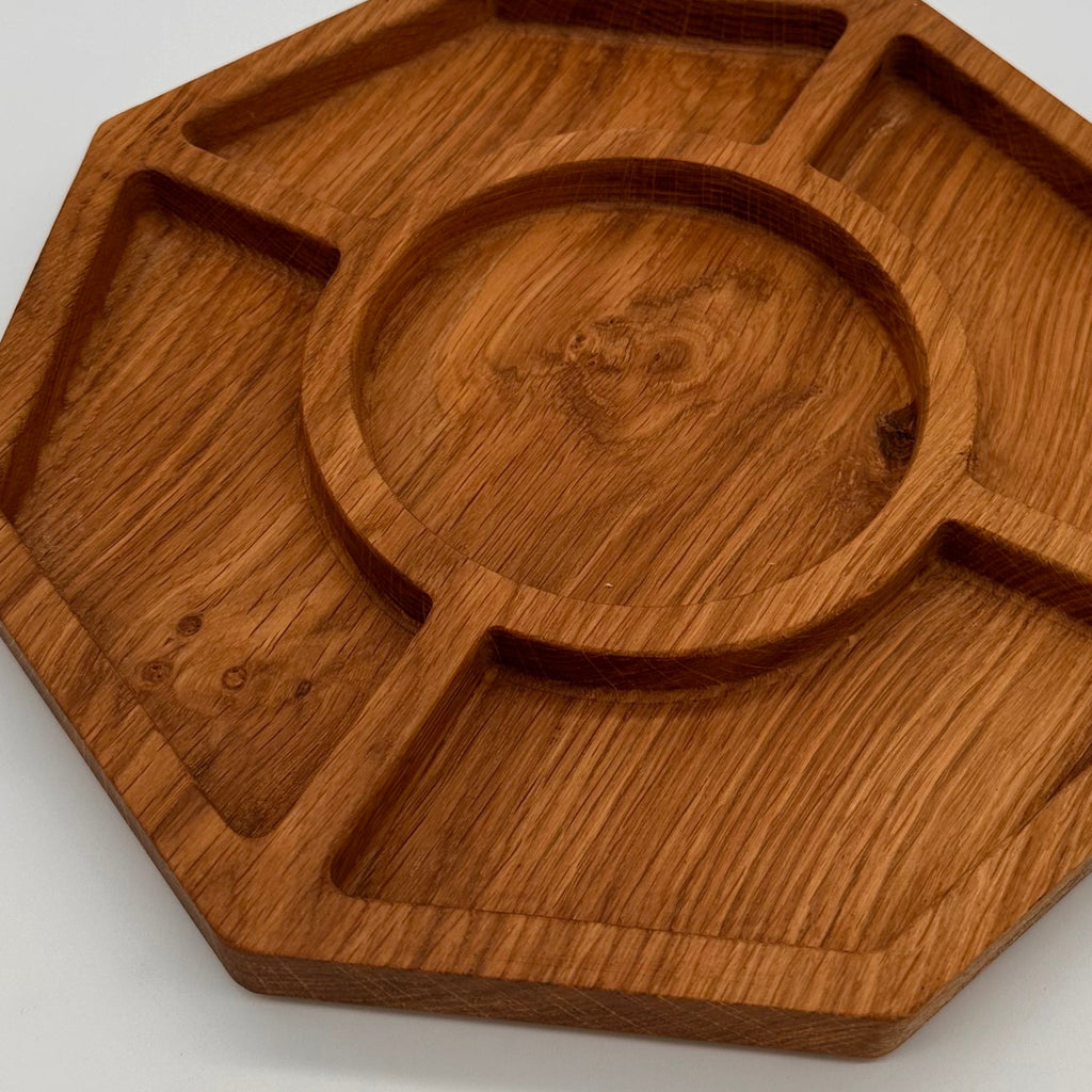 Wooden tray with geometric design on a light gray background