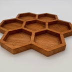 Wooden honeycomb tray on a white background