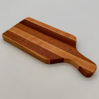 Wooden cutting board on a light gray background