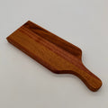 Wooden cutting board on a light gray background