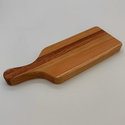 Wooden cutting board with a handle on a light gray background