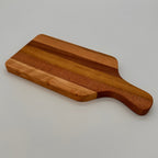 Wooden cutting board on a light gray background