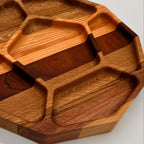 Wooden tray with divided sections on a white background