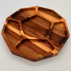 Wooden tray with divided sections on a light gray background