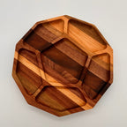 Wooden tray with geometric design on a light gray background
