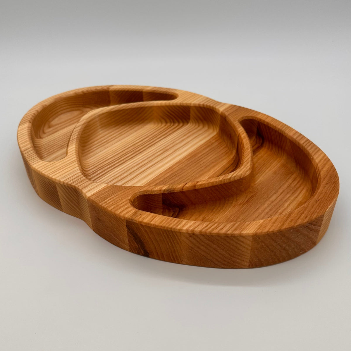 Set of wooden trays on a light gray background