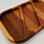 Wooden tray with compartments on a light gray background