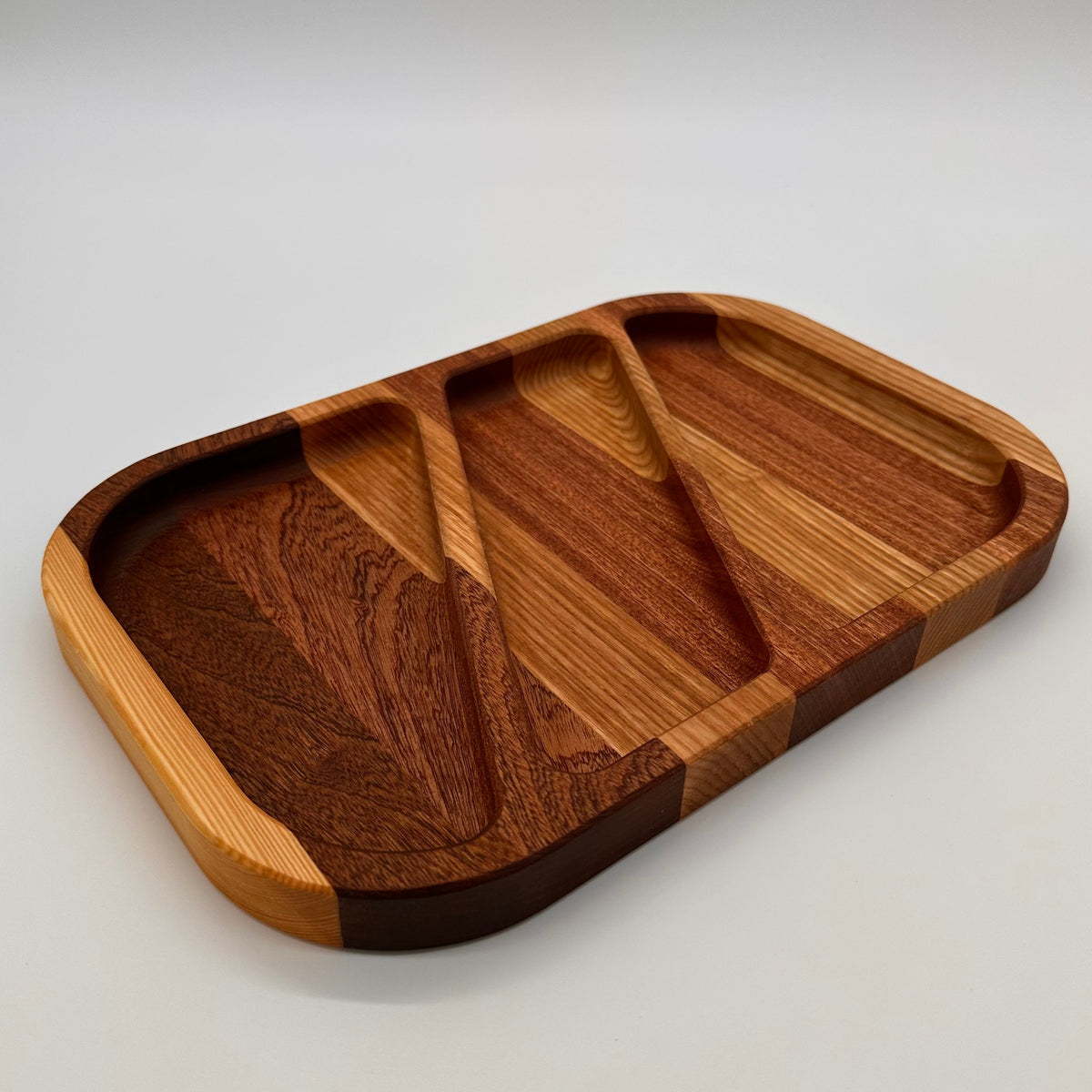 Wooden tray with a natural finish on a light gray background