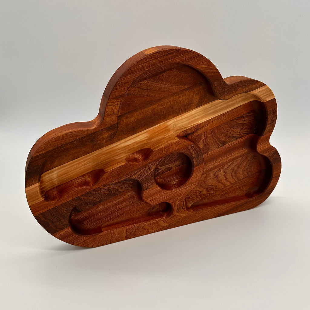 Wooden cloud-shaped cutting board on a white background