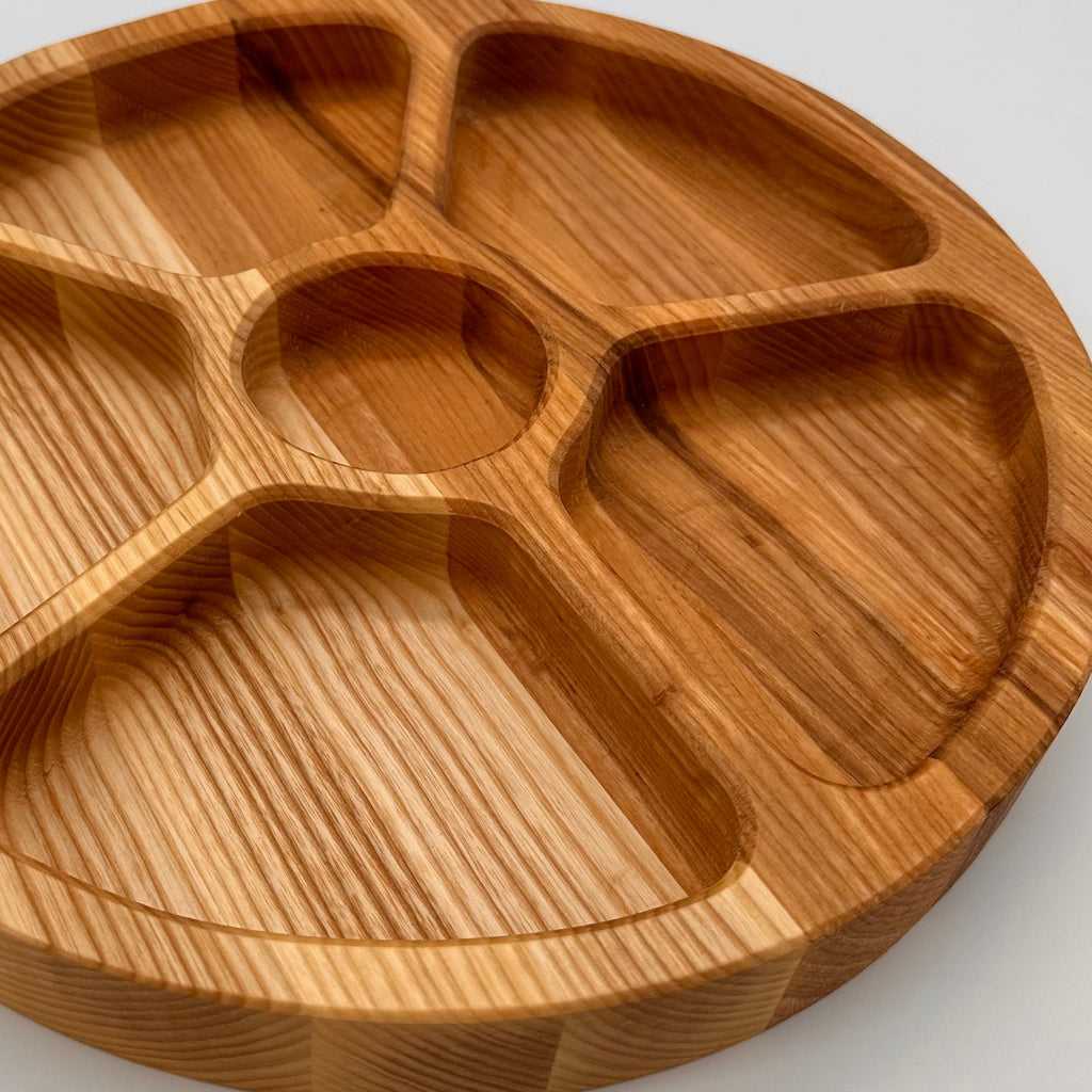 Wooden divided plate on a white background