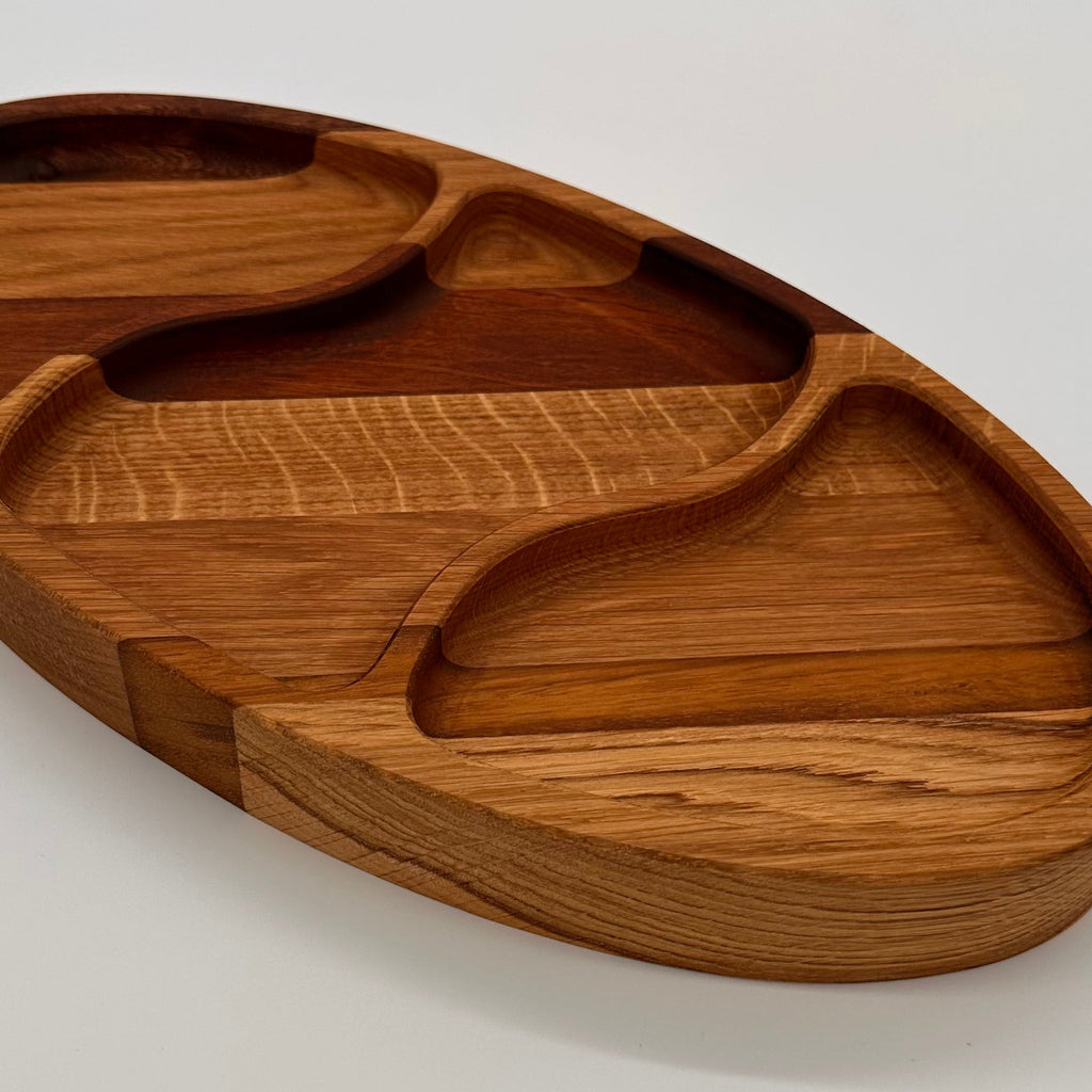 Wooden tray with divided sections on a white background