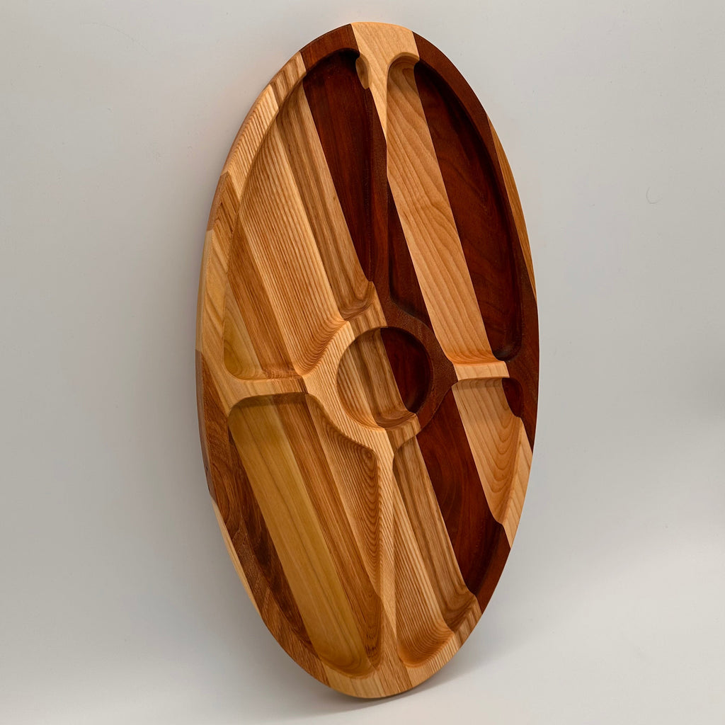 Wooden cutting board with分区设计 on a white background