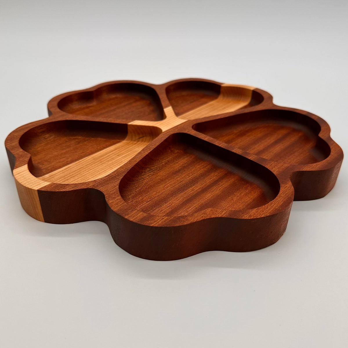 Wooden tray with a unique design on a light gray background