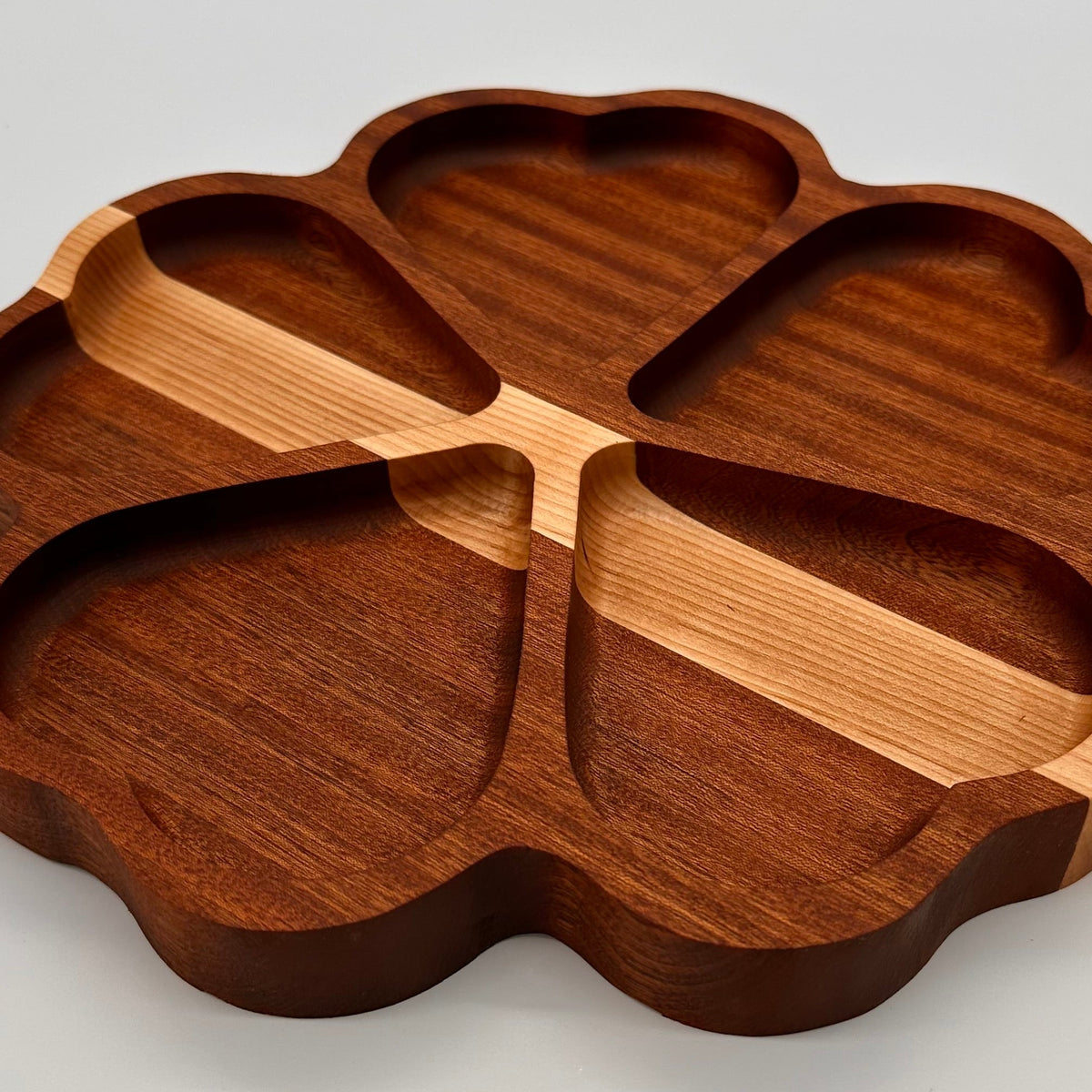 Wooden tray with a unique design on a light gray background