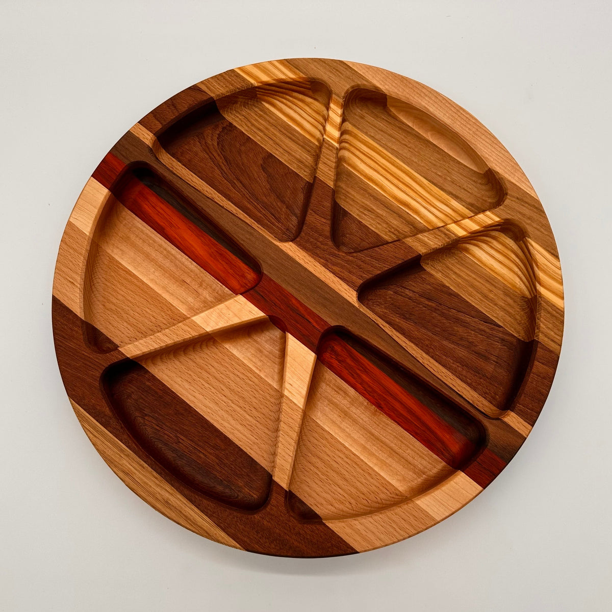 Wooden cutting board with geometric design on a light gray background