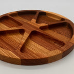 Wooden tray with divided sections on a white background