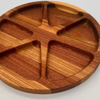 Wooden divided plate on a light gray background