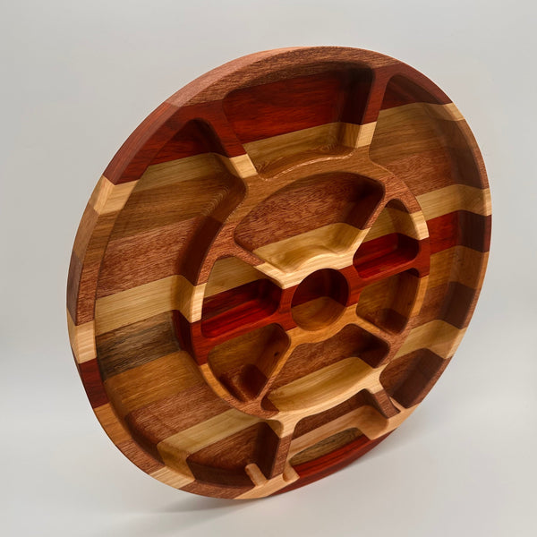 Wooden cutting board with geometric patterns on a light gray background