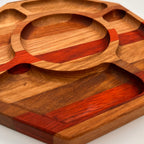 Wooden tray with geometric design on a white background