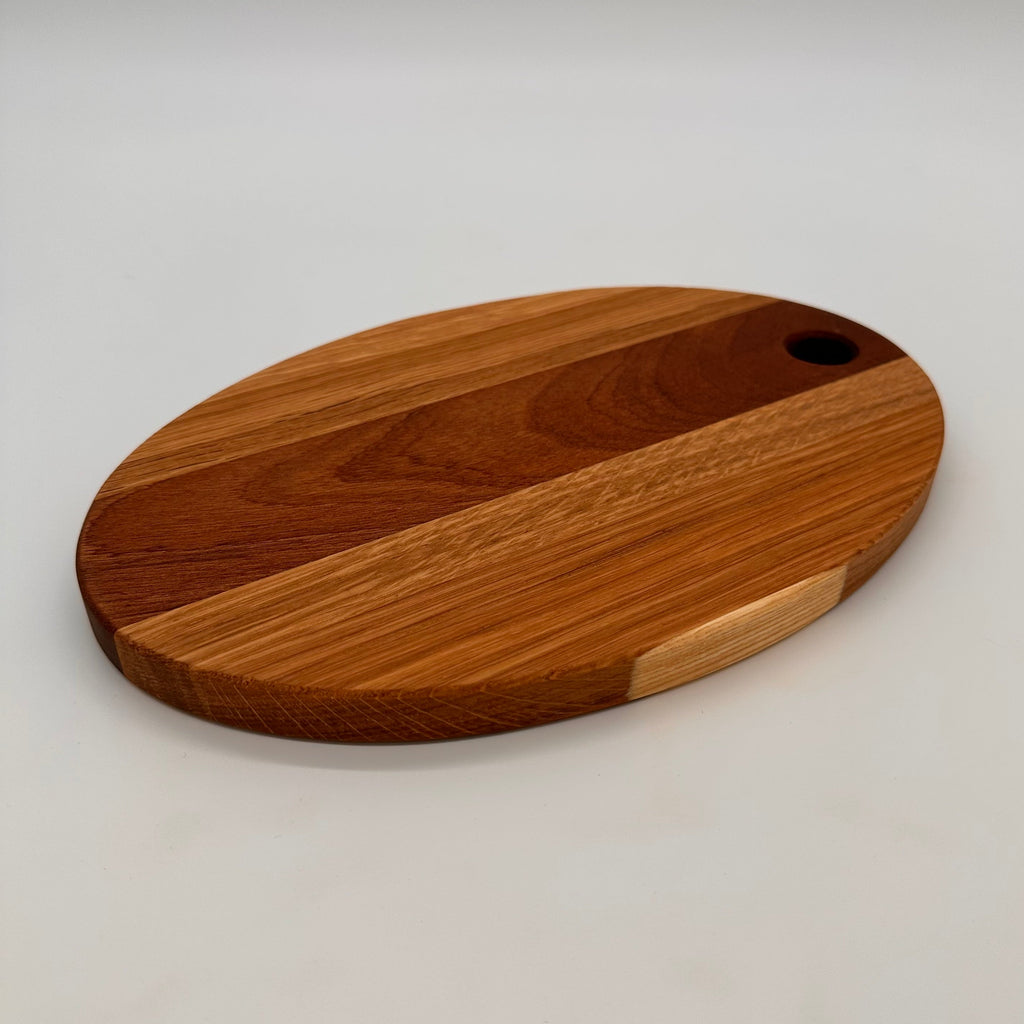 Wooden cutting board with a handle on a white background