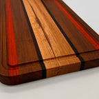 Wooden cutting board with a striped pattern on a white background