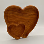 Wooden tooth-shaped object on a light gray background