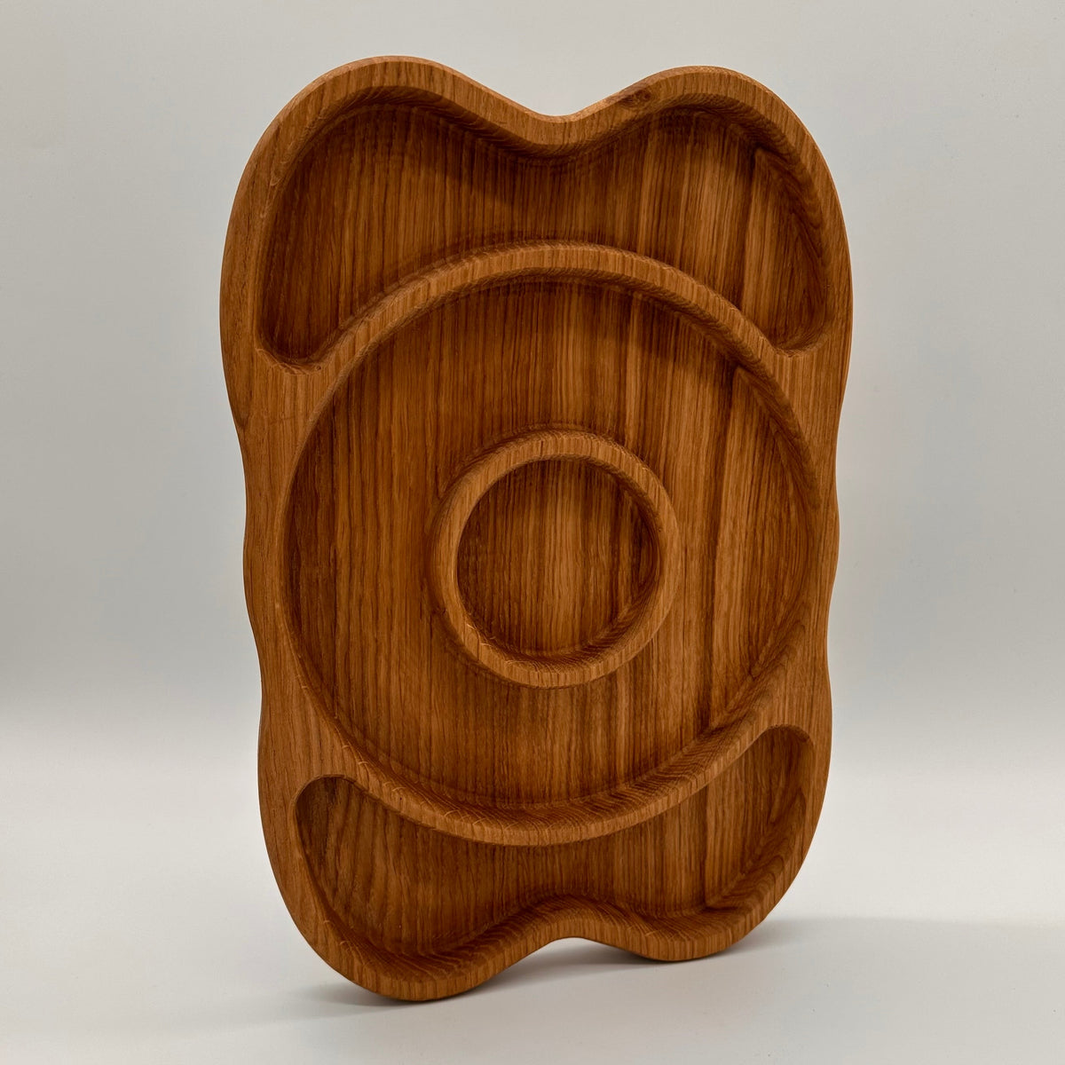 Wooden tray with a unique design on a white background