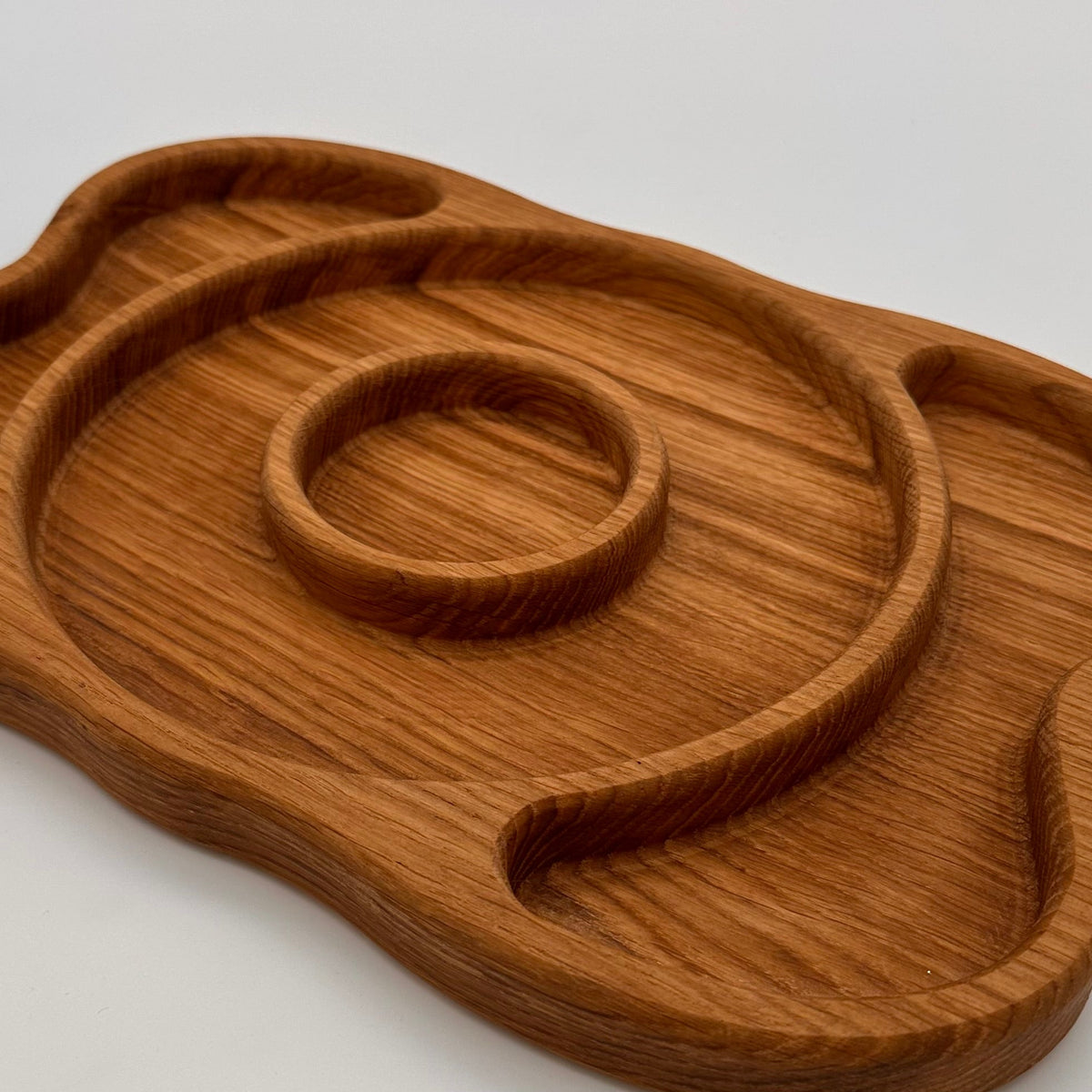 Wooden tray with a unique design on a white background