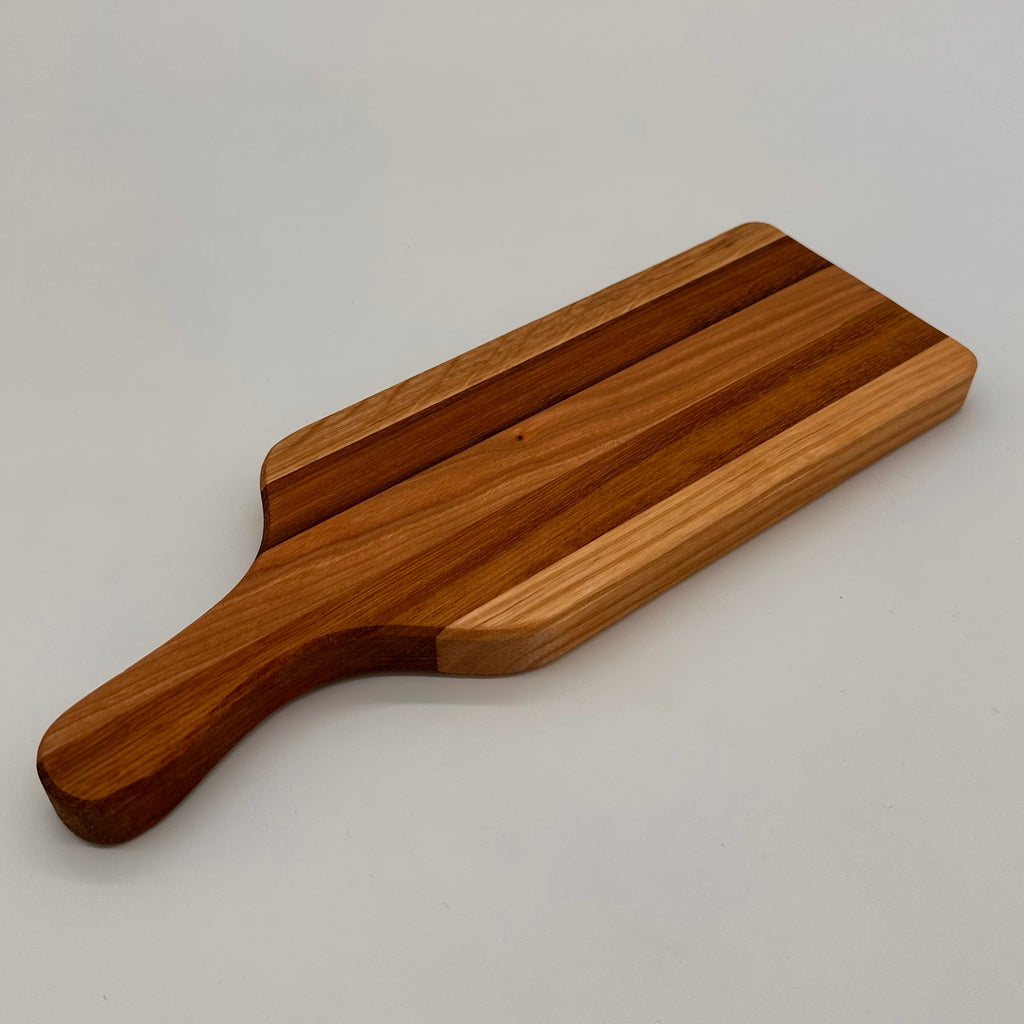 Wooden cutting board on a plain background